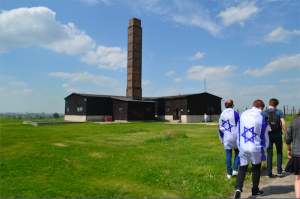 SMOKESTACK: Clearly visible from the surrounding city of Lublin, the chimney at Majdanek jutted into a blue sky in a scene of unsettling beauty as seniors on the Poland-Israel trip approached.