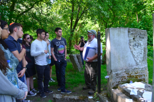 CONNECTION: A guide told Shalhevet seniors the story of the Chozeh of Lublin beside his grave May 19.