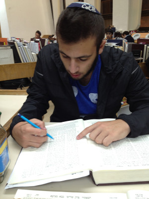 INDOORS: Alumnus Mati Hurwitz '15 studying at Yeshivat Har Etzion, whose students now must ask for permission to visit other parts of the country.