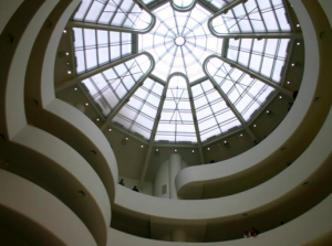 A spider's web design divides the light streaming in from the roof of the circular seven-story Guggenheim Museum in New York.