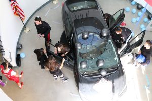 TRAFFIC: A black car parked in the lobby by seniors greeted students on the first full day of Color War.