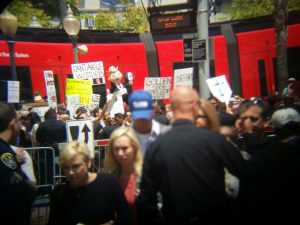 2:08 PM: An anti-Trump protest across the street from the rally