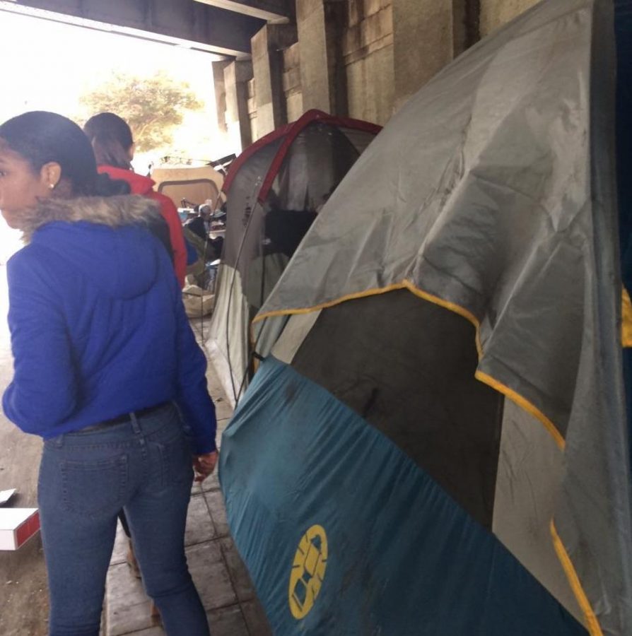 UNDERNEATH%3A+Juniors+Rosie+Wolkind+and+Maia+Zelkha+visited+a+homeless+encampment+beneath+a+Downtown+freeway+to+distribute+cameras.+They+have+received+four+in+return+so+far.