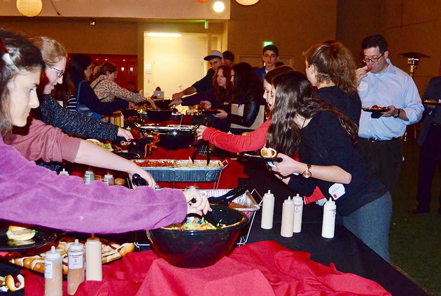BUFFET: Students and parents filled their plates at this year's less expensive Open House.