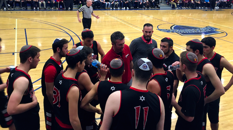 CONFER%3A+FIrehawk+players++met+with+Coach+Ryan+Coleman+during+the+championship+game+at+the+Red+Sarachek+Tournament+March+6+at+Yeshiva+University.